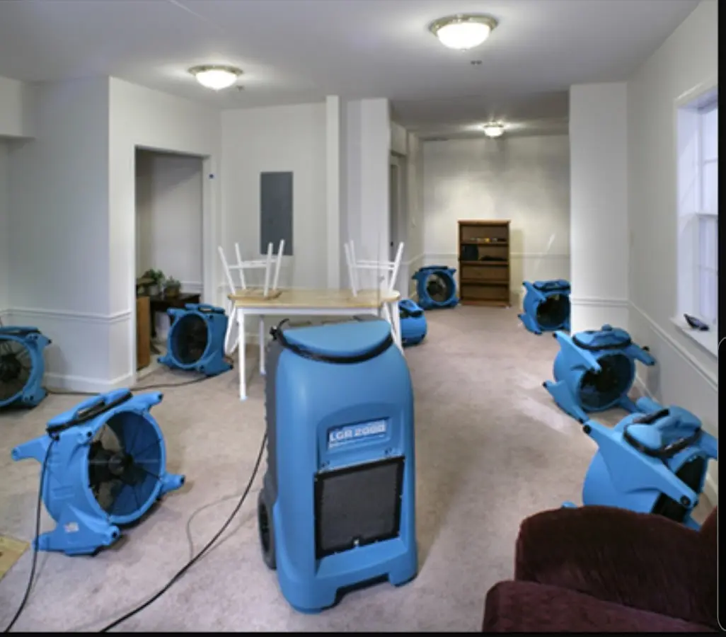 Air movers and dehumidifier setup for Water Damage Restoration in Brockport